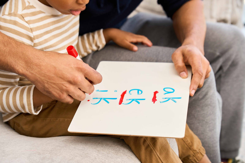 Phonics sounds on a whiteboard.